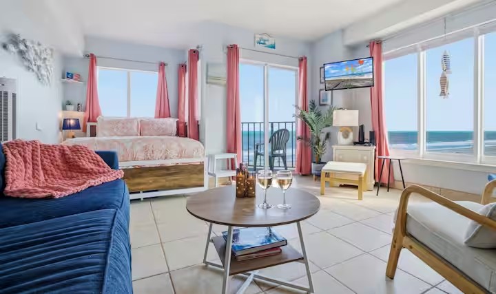 Living area with a sleeper sofa and ocean-facing windows
