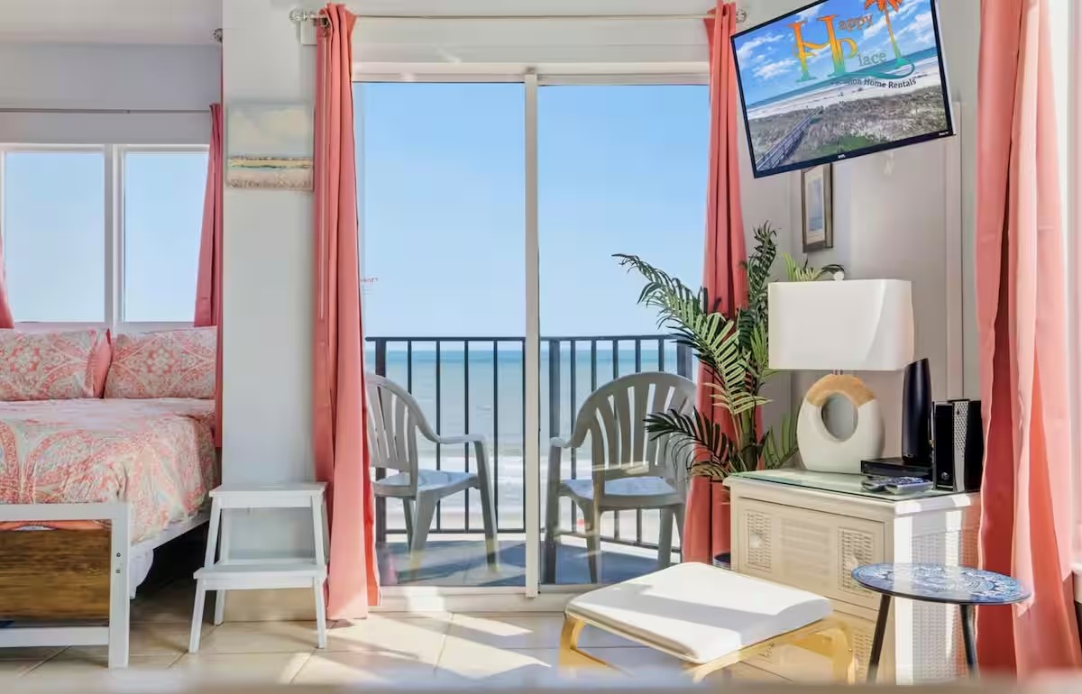 Studio interior looking out to the oceanfront balcony